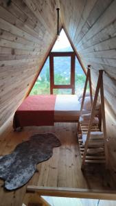 a bedroom with a bed and a window in a cabin at Neyla Suit in Arhavi +44 photos