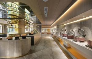 a large kitchen with many pots and pans at Ebo Hotel in Hangzhou