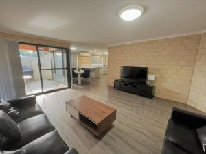 a living room with a couch and a coffee table at Stay By The Sea Esperance in Esperance