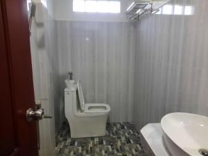 a bathroom with a toilet and a sink at Realkhom Homestay in Siem Reap +46 photos
