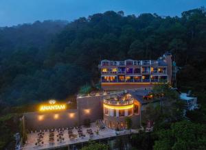 an amazon hotel in the mountains at night at Anantam Resort & Spa in Kasauli