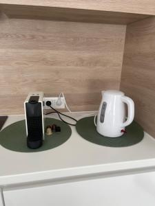 a counter top with a coffee maker and a toaster at Christy’s House in Debrecen
