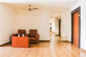 a living room with a couch and a table at Collection O Kk Trends in Vijayawada