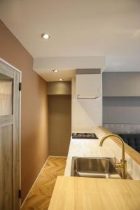 a kitchen with a sink and a counter top at ZDT-406 in Tokyo