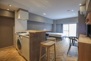 a kitchen with a sink and a counter with a stove at ZDT-406 in Tokyo