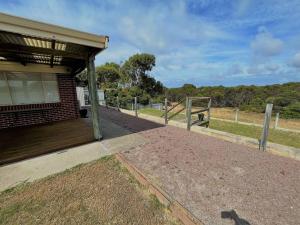 a porch of a house with a fence at The Willow in Esperance