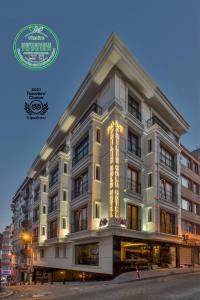 a building with a sign on the side of it at Aprilis Gold Hotel - Special Category in Istanbul