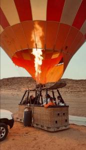 a hot air balloon in the middle of the desert at Fun Camp Wadi Rum in Wadi Rum