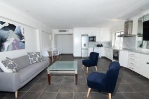 a living room with a couch and a table at 21 Bronze Bay Umhlanga Rocks in Durban