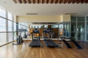 a gym with treadmills and ellipticals in a building at Best Western Heritage in Cox's Bazar