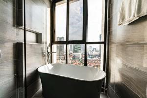 Ένα μπάνιο στο Noden Hotel & Apartment
