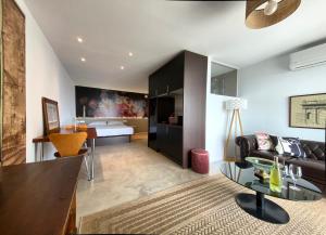 a living room with a couch and a table at La Paratá Suites Mojácar in Mojácar