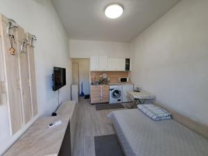 a living room with a couch and a kitchen at relax in Plovdiv +21 photos