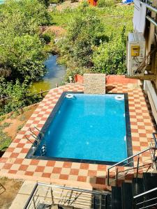 an overhead view of a swimming pool in a yard at Hotel Lake Paradise Mahabaleshwar in Mahabaleshwar