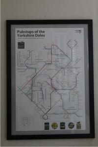 a framed picture of a subway map in a frame at Coddiwomple in Leyburn