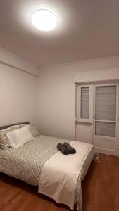 Postel nebo postele na pokoji v ubytování Apartamento bem localizado