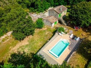 an aerial view of a house with a swimming pool at Holiday Home Le Moulin - SGB100 by Interhome in Saint-Genest-de-Bauzon