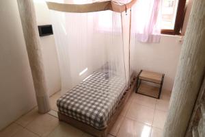 Postel nebo postele na pokoji v ubytování Seabreeze Hostel Bali