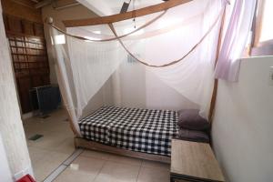 Postel nebo postele na pokoji v ubytování Seabreeze Hostel Bali