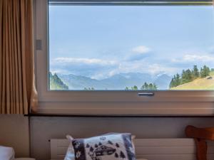 a large window with a view of a mountain at Apartment Rosablanche C64 by Interhome in Siviez