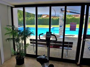 a view of a pool through a sliding glass door at Studio Valdor by Interhome in Crans-Montana