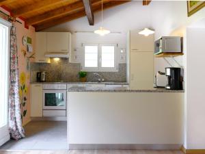 a kitchen with a white counter top in a room at Holiday Home Casa Felice by Interhome in Anvéuda