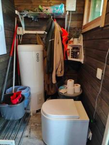 a small bathroom with a toilet in a house at Mökki Mannervaarassa, Joensuussa in Mannervaara