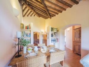 a dining room with a wooden table and chairs at Apartment Casa del Gemmo by Interhome in Sestri Levante
