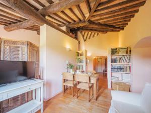 a living room with a table and a tv at Apartment Casa del Gemmo by Interhome in Sestri Levante