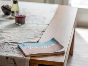 a plate on a table with a menu on it at Apartment Fischerstube by Interhome in Norddeich