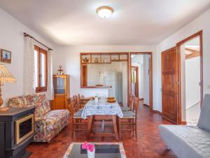 een woonkamer met een tafel en een bank bij Apartment Ullastres by Interhome in Punta Grossa