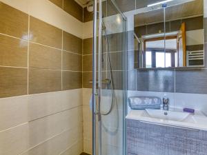 a bathroom with a shower and a sink at Apartment Belleville Caron-11 by Interhome in Les Menuires