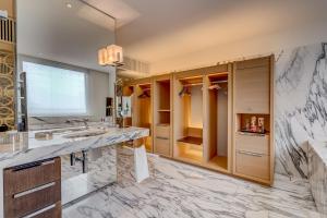 a bathroom with a marble counter and a sink at InterContinental Genève by IHG in Geneva