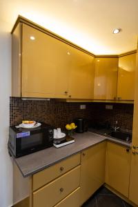 A kitchen or kitchenette at Friends Hostel & Apartments