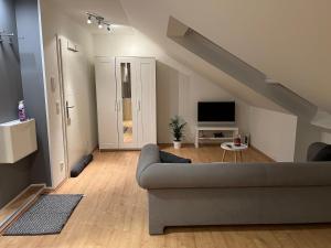 TV a/nebo společenská místnost v ubytování Wohlfühl Apartment