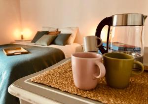 Letto o letti in una camera di L’AMANTINE Chambres d’hôtes et gîte