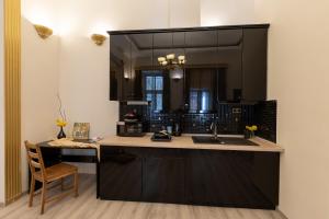 A kitchen or kitchenette at Friends Hostel & Apartments
