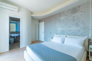 מיטה או מיטות בחדר ב-Casa di Cami by Wonderful Italy