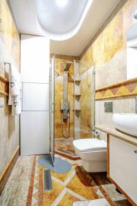 a bathroom with a shower and a toilet and sink at Victoria Residence Apartments in Budva