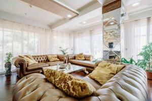 a large living room with a couch and a table at Victoria Residence Apartments in Budva