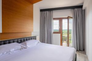Postel nebo postele na pokoji v ubytování Precise House Montaperti Siena
