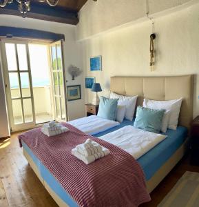 A bed or beds in a room at Villa Filoreto