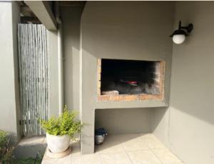 a brick fireplace in the side of a building at Accommodation @Sea Trader in St. Helena Bay