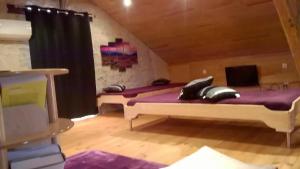 Cama o camas de una habitación en Gîte la Forge 4 étoiles