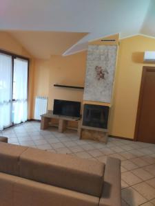 TV a/nebo společenská místnost v ubytování Residenza Giulia e Marco