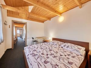 a bedroom with a bed and a wooden ceiling at Apartment Marika 2 by Interhome in Černý Dŭl +35 photos