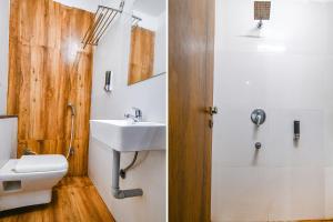a bathroom with a toilet and a sink and a shower at FabHotel Hello Homz in Indore