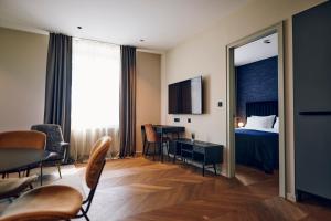 a hotel room with a bed and a table and a mirror at Hotel REPUBLIKA in Zagreb +53 photos