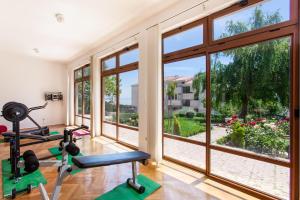 a gym with a large window and two exercise machines at Villa Sea Breeze in Split