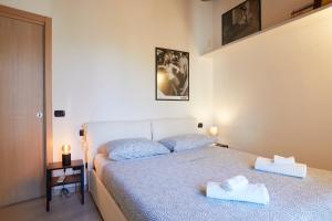 Crocetta Modern Flat tesisinde bir odada yatak veya yataklar